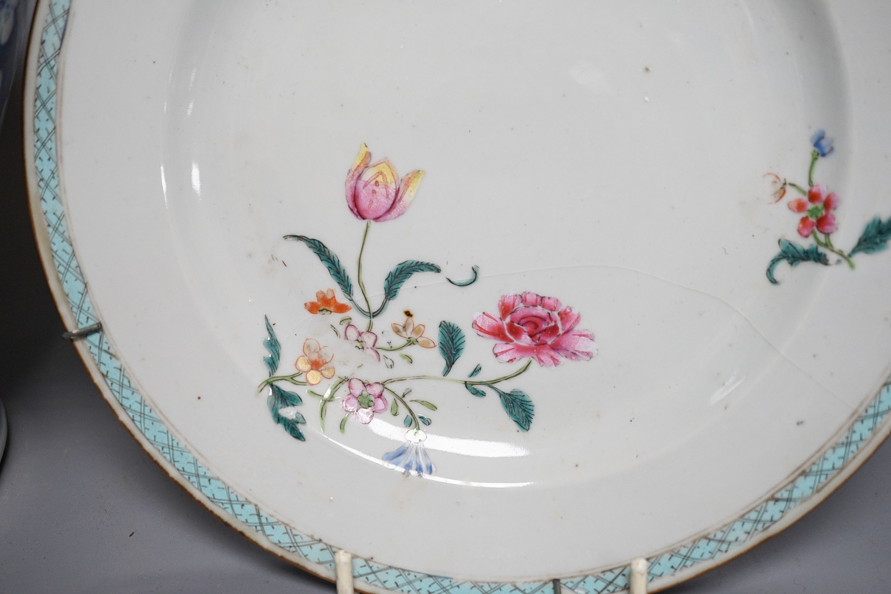 A 19th century Chinese blue and white Prunus jar and cover, 36cm and a group of 18th century Chinese export famille rose tea bowls and a plate